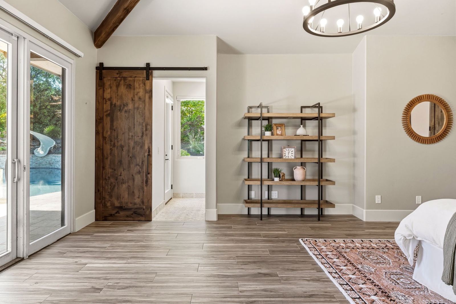 Guest suite with barn door to its private bath