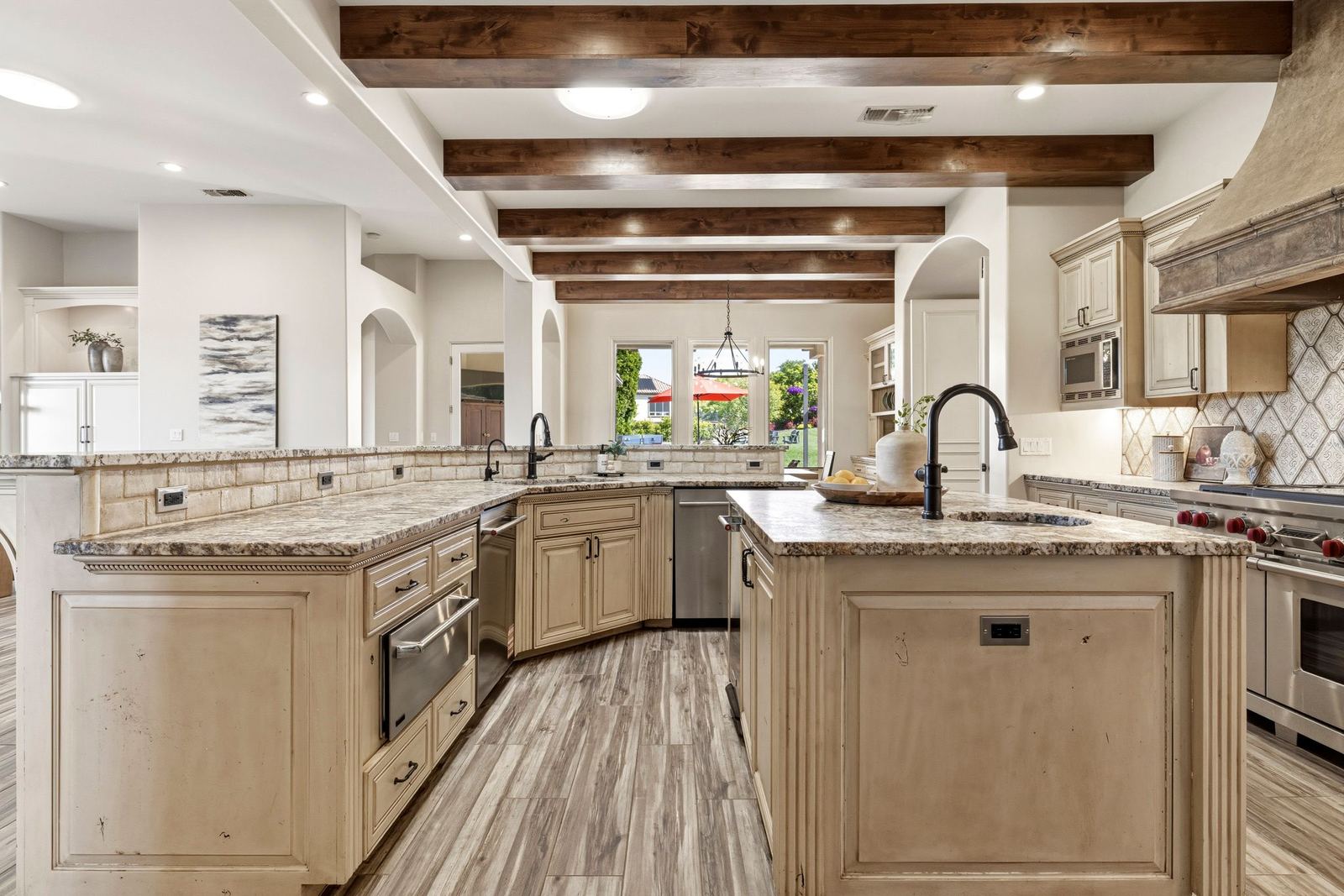Kitchen island with prep sink and leathered granite