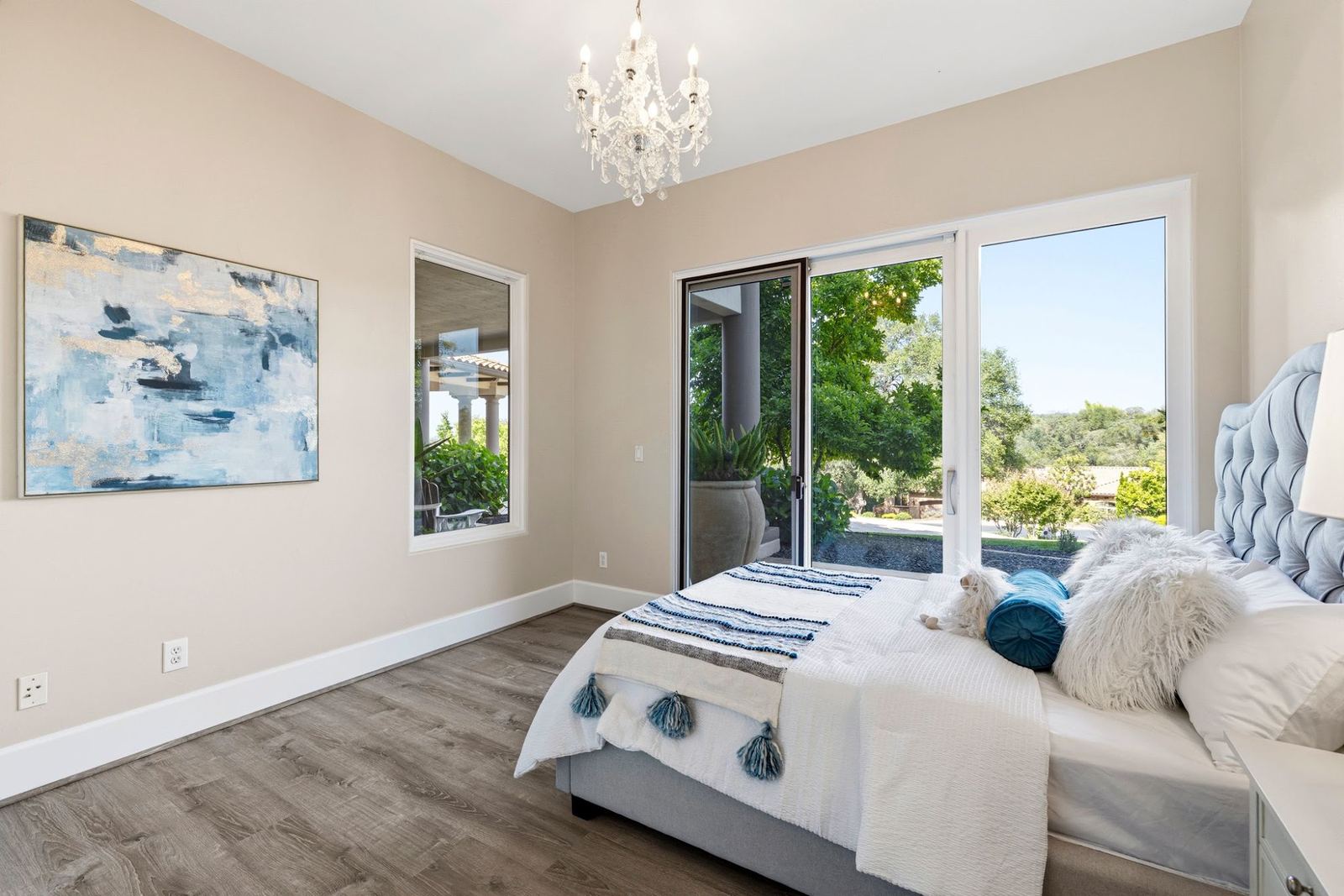 Lower-level bedroom with sliding doors to a patio