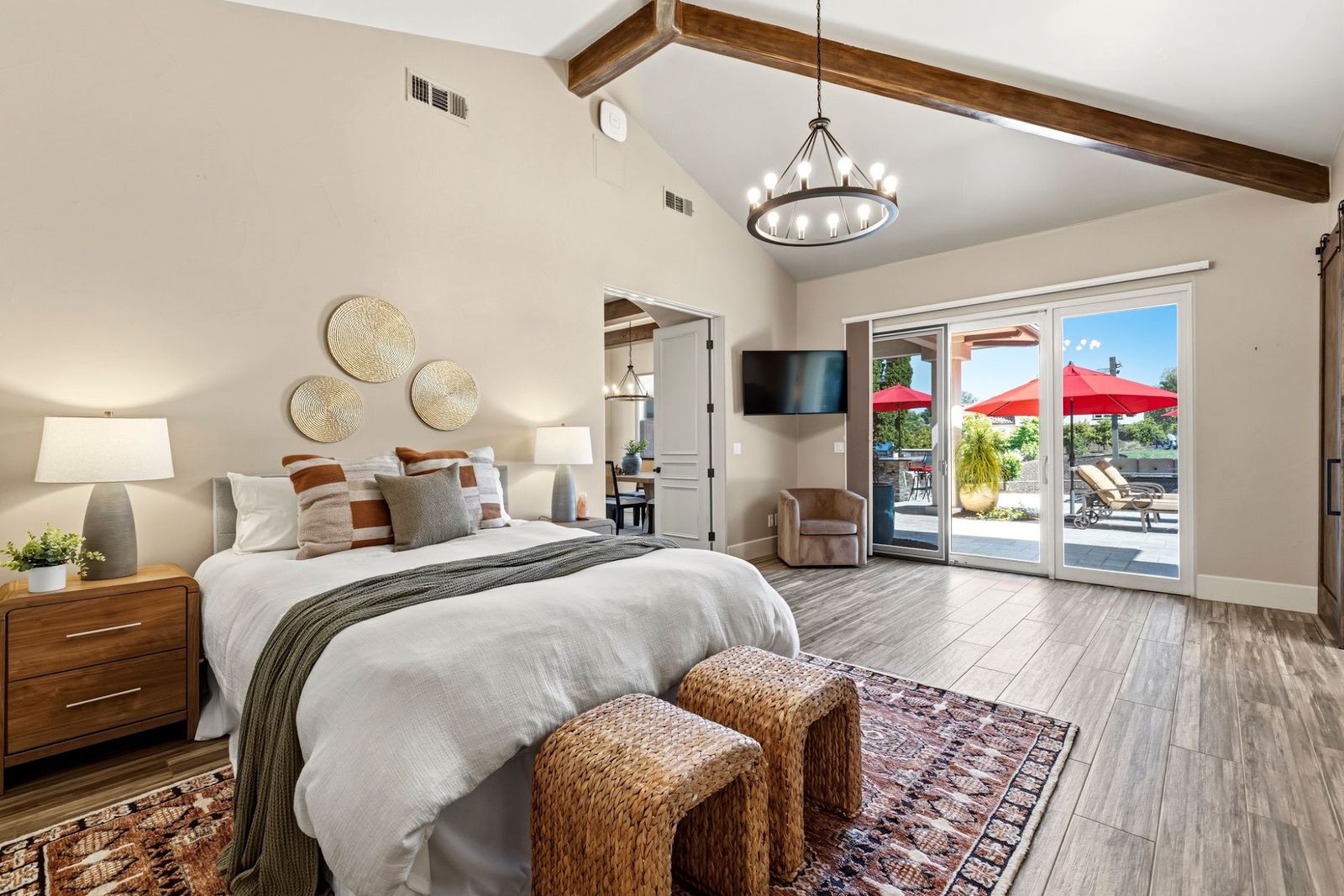 Office/guest suite with beamed ceiling and doors to the pool yard